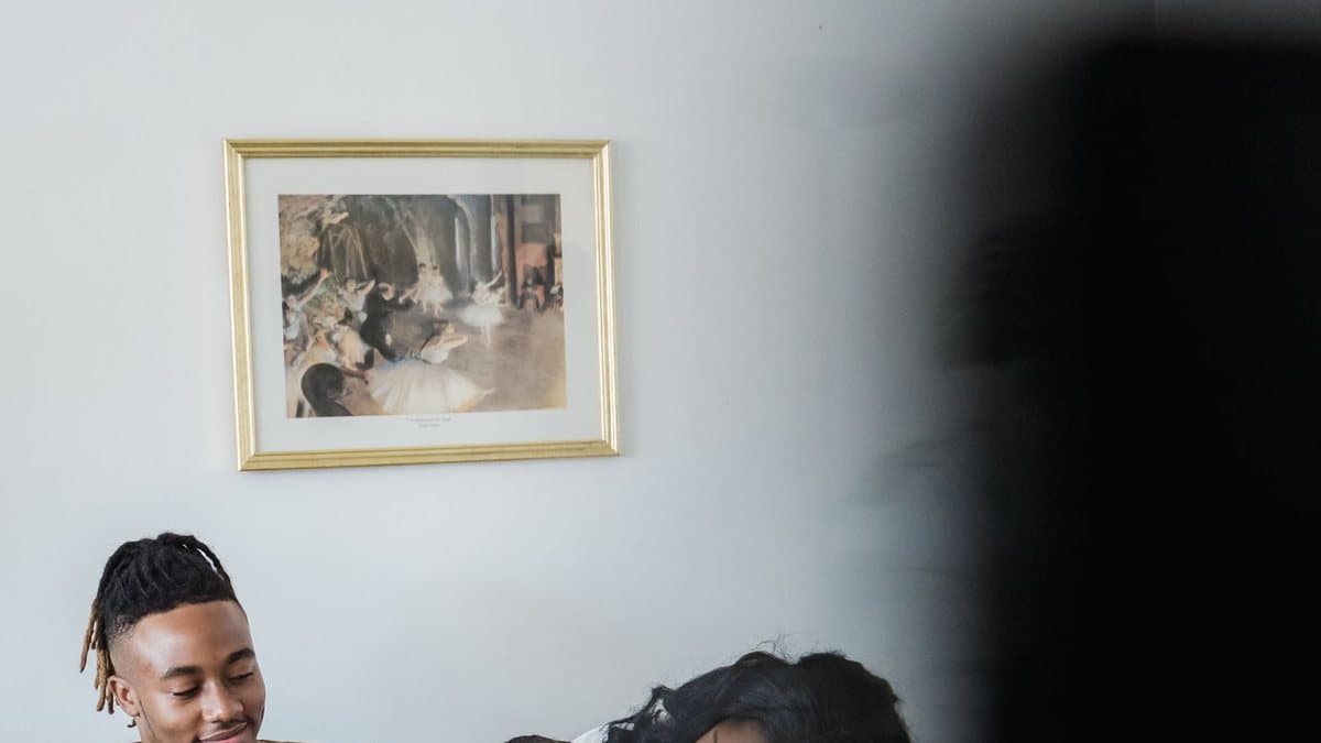 Family watching television together at home