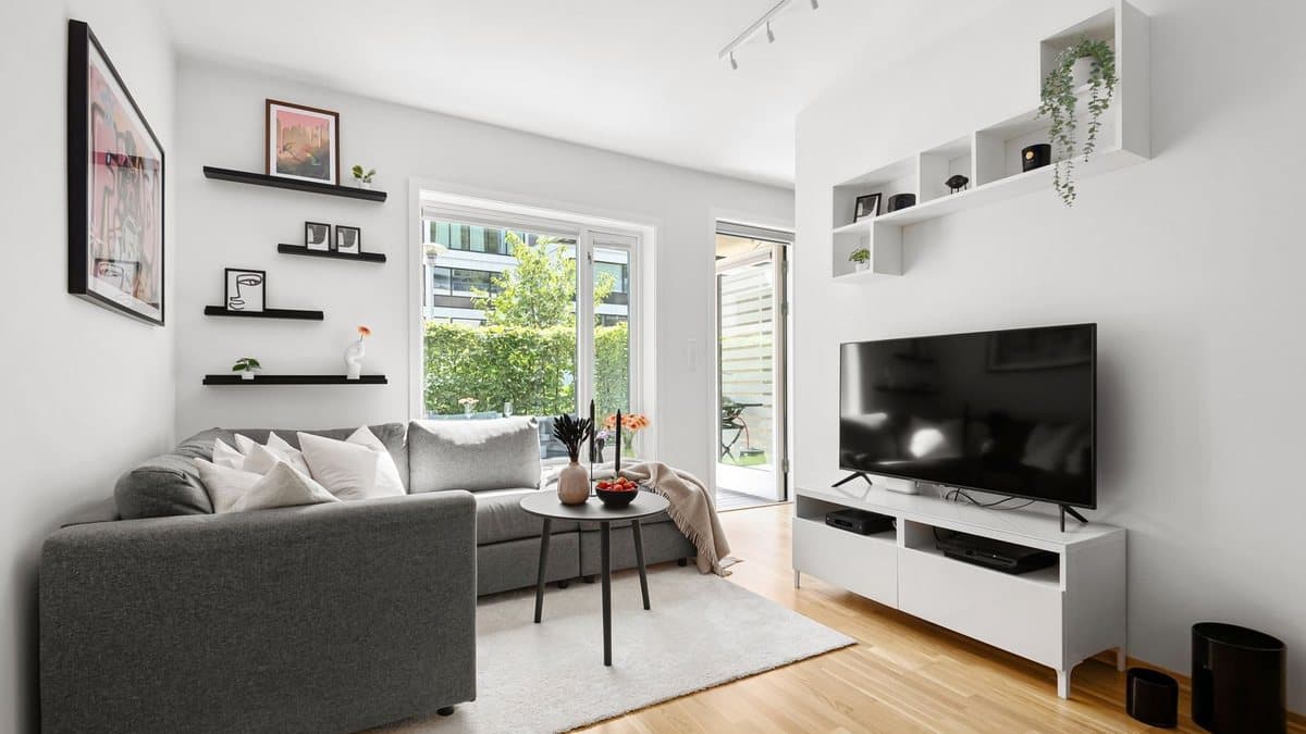 Modern living room featuring a large smart television