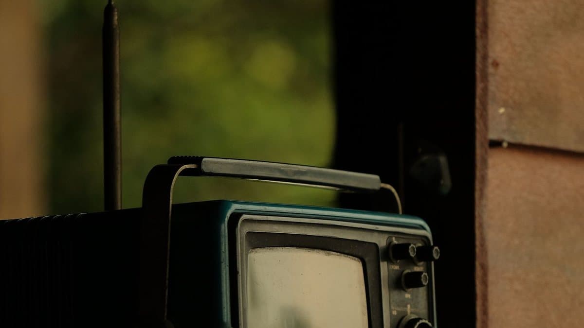 Vintage portable television representing traditional cable-era TV