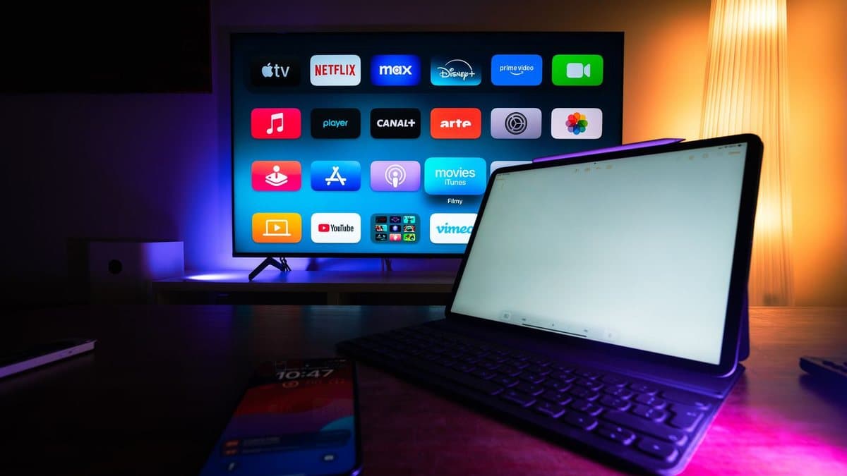 Smart TV and tablet displaying streaming apps in a modern home setup