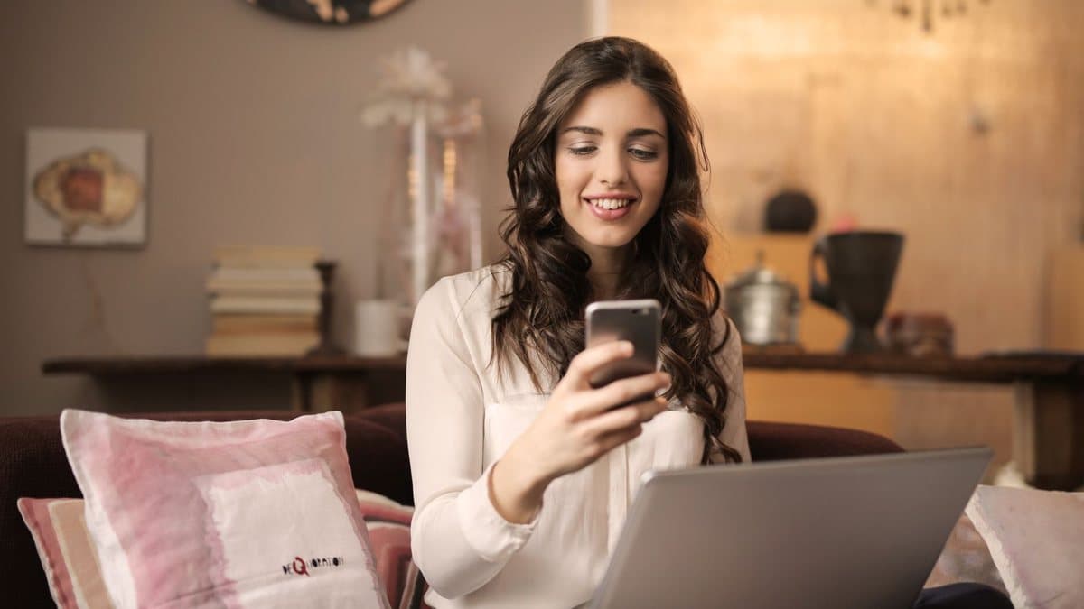 Person using a laptop at home, representing checking home internet performance