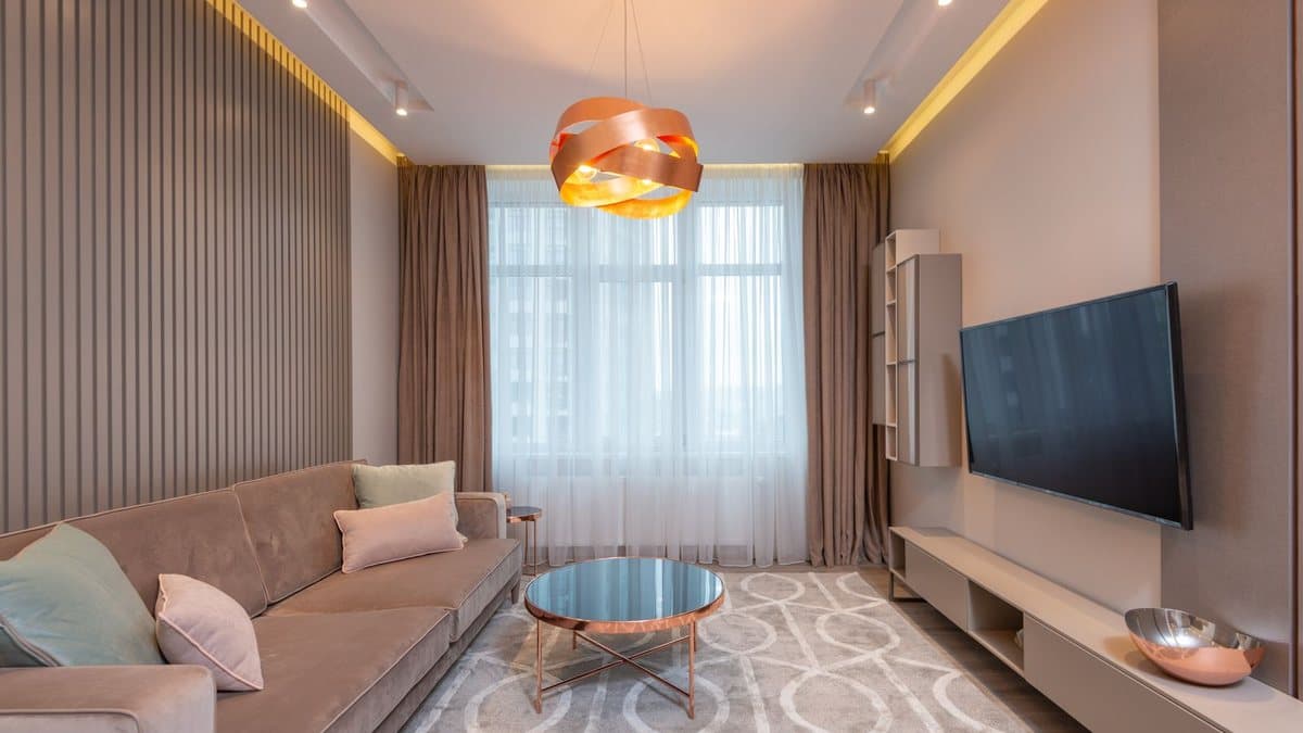 Contemporary living room with a premium television and sofa setup