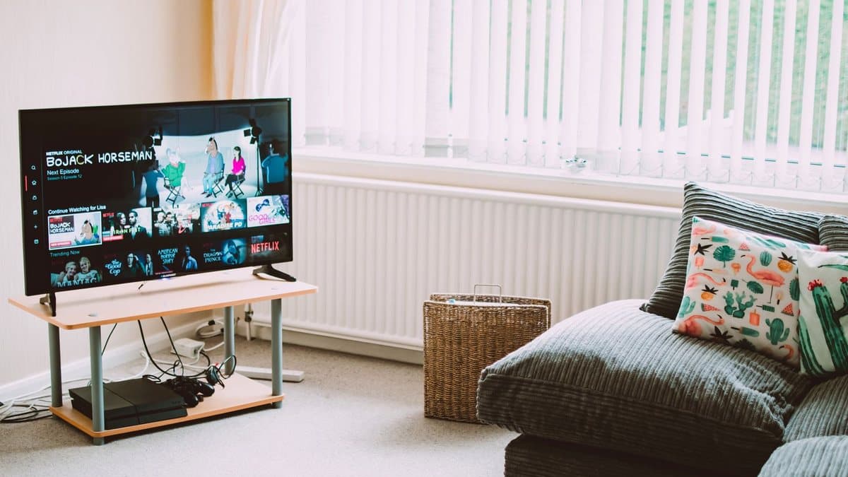 Modern flat-screen smart TV streaming content in a bright living room